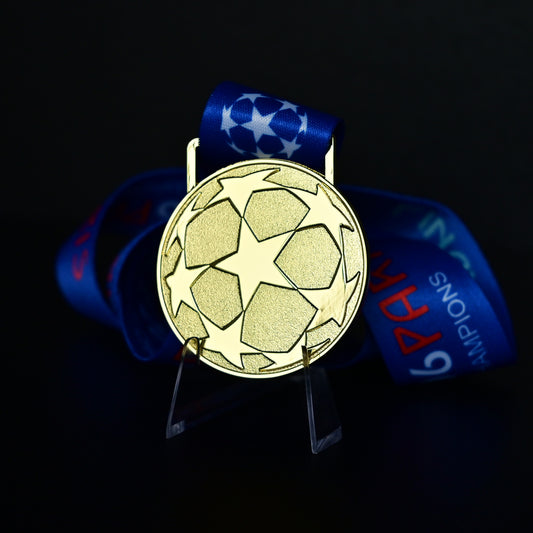 2006 UEFA Champions League Medal Back View, Barcelona Champion Gold Alloy Medal with Starball Pattern, Commemorative Football Medal Close-up on Clear Stand