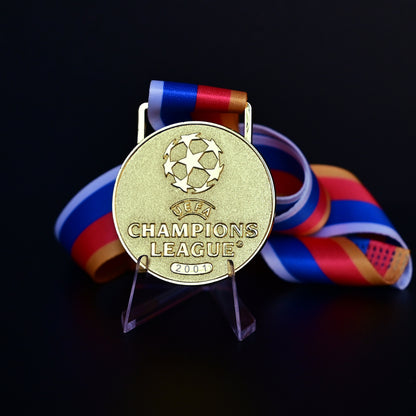 UEFA Champions League Medal Front View, Porto Champion Gold Alloy Medal with Official UCL Logo, 2001 Final Commemorative Medal on Clear Display Stand with Blue Tournament Ribbon