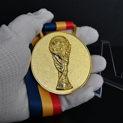Gold medal from the 2002 FIFA World Cup Korea Japan Back Close-Up Held in White Gloves, Showcasing Intricate Trophy Designhand.