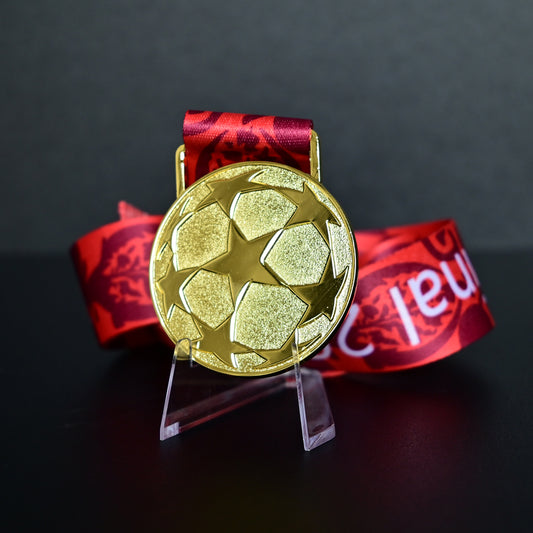 2005 UEFA Champions League Medal Back View, Liverpool Champion Gold Alloy Medal with Starball Pattern, Commemorative Football Medal Close-up on Clear Stand
