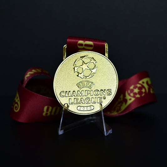 2008 UEFA Champions League Medal Front View, Manchester United Champion Gold Alloy Medal with Official UCL Logo, 2008 Final Commemorative Medal on Clear Display Stand with Blue Tournament Ribbon