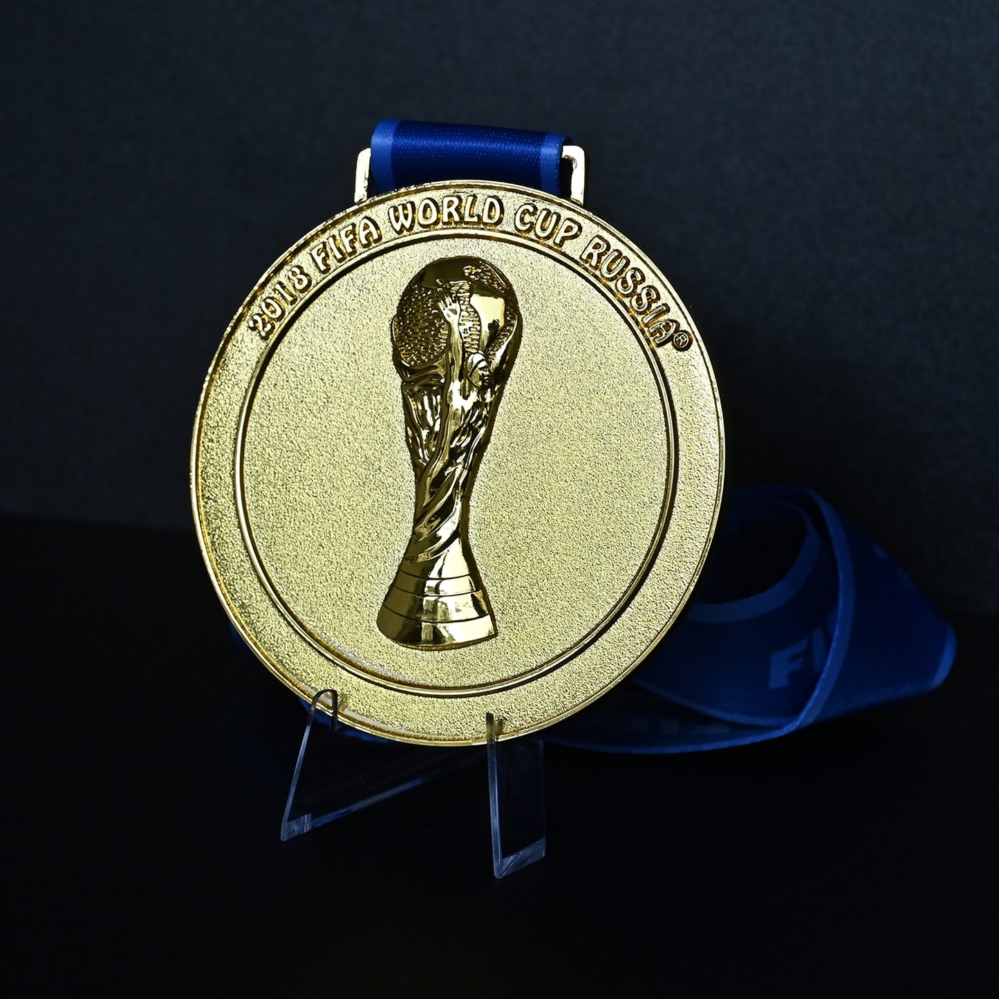 2018 France World Cup Champion Medal - Close-Up of 3D FIFA Trophy Embossment & "2018 FIFA WORLD CUP RUSSIA" Engraving, Blue Ribbon Detail