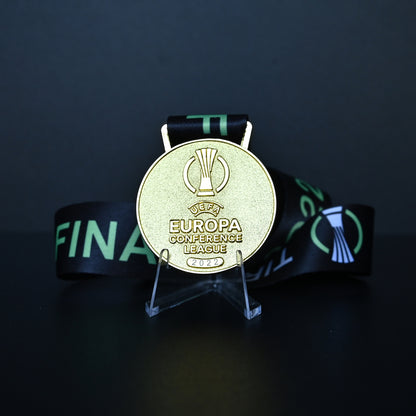 2022 UEFA Europa Conference League Medal Front View, Roma Champion Gold Alloy Medal with Official UECL Logo, Tirana Final Commemorative Medal on Clear Display Stand, Football Fan Collectible