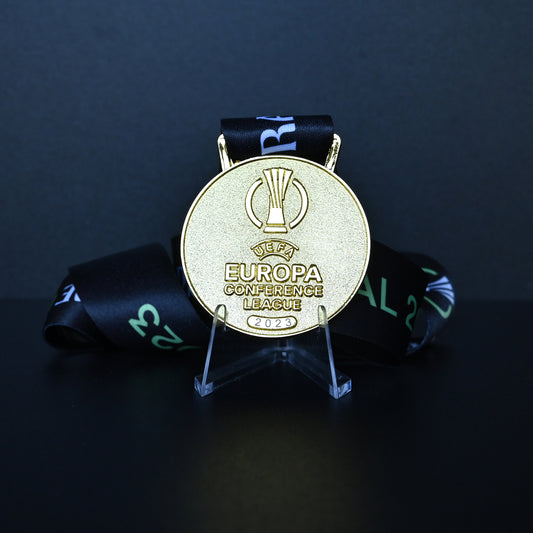 2023 UEFA Europa Conference League Medal Front View, West Ham United Champion Gold Alloy Medal with Official UECL Logo, Prague Final Commemorative Medal on Clear Display Stand, Football Fan Collectible
