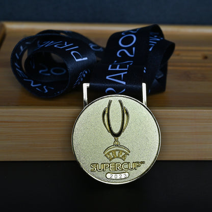 2023 UEFA Super Cup Medal Front View, Manchester City Champion Gold Alloy Medal with Official UEFA Logo, Athens Final Commemorative Medal on Clear Display Stand, Football Fan Collectible