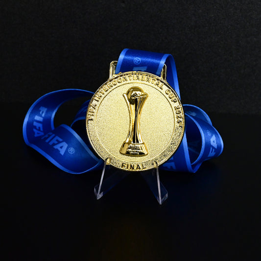 2024 FIFA Intercontinental Cup Medal Front View, Real Madrid Champion Gold Alloy Medal with Official FIFA Logo, Doha Final Commemorative Medal on Clear Display Stand, Football Fan Collectible