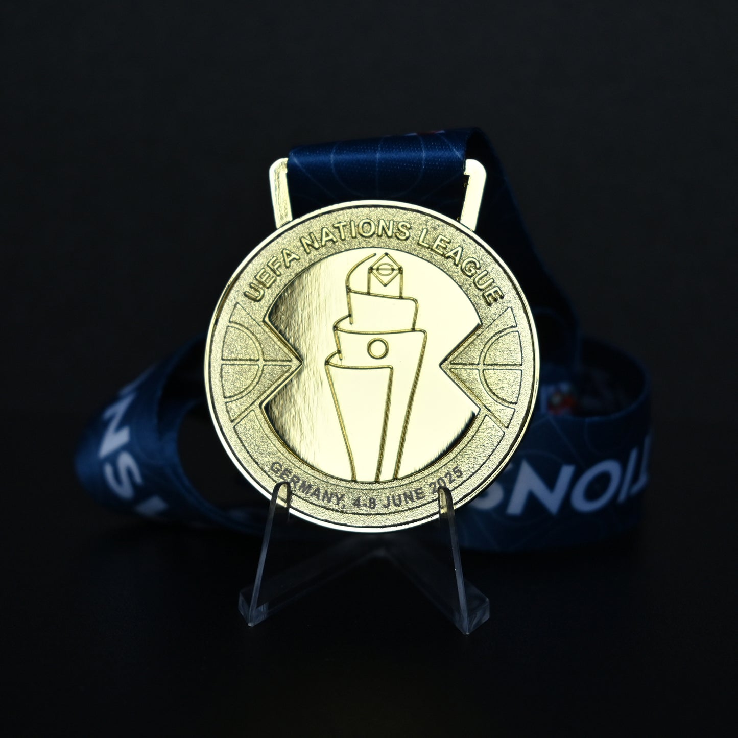 Medal with UEFA Nations League logo on a dark background