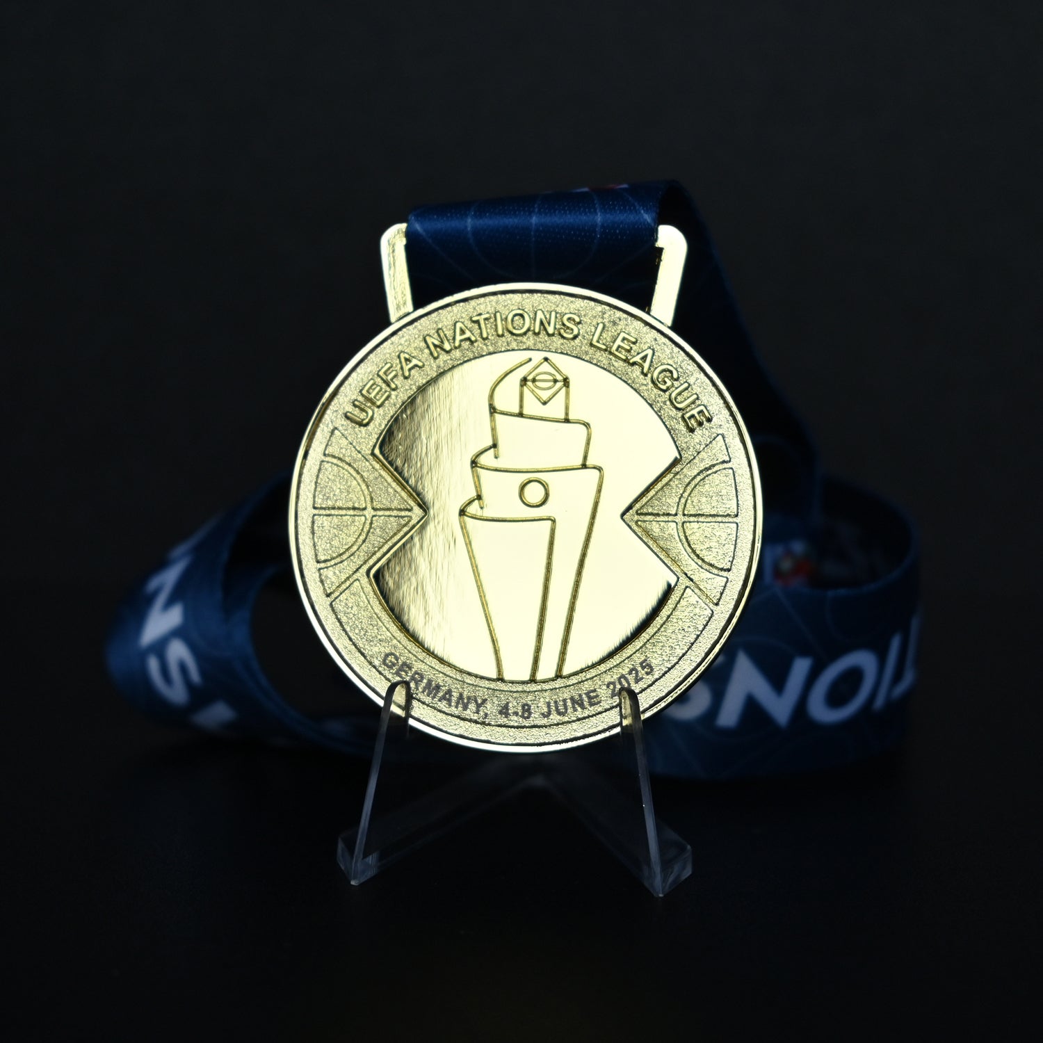 Medal with UEFA Nations League logo on a dark background