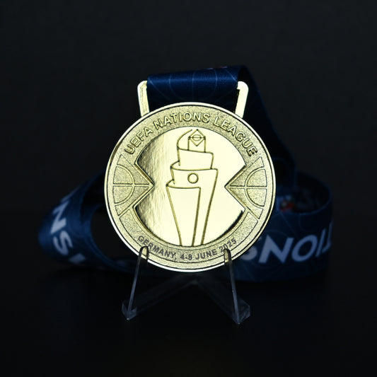 Medal with UEFA Nations League logo on a dark background
