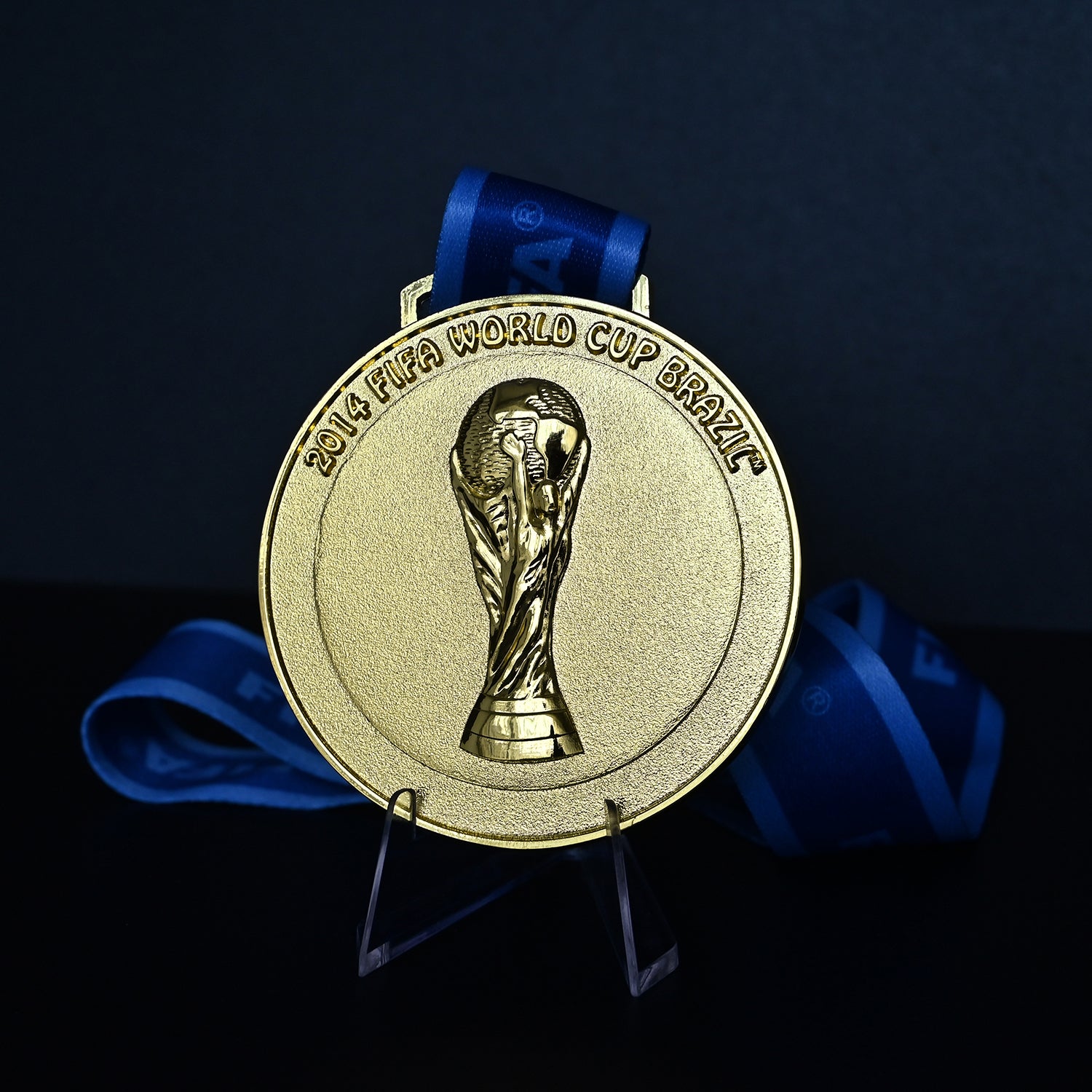 Brazil 2014 World Cup Champions Medal - Back View with Blue FIFA Ribbon & Stand, Detailed 3D World Cup Trophy Embossment, Premium Alloy Souvenir for Fans