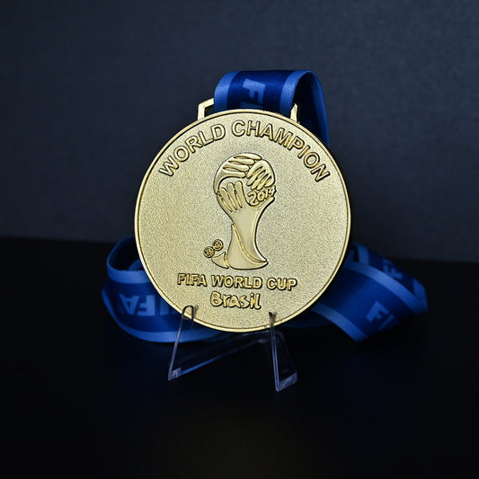 Brazil  2014 FIFA World Cup Germany Champions Medal - Front View with Blue FIFA Ribbon, Featuring "WORLD CHAMPION" Text & Stylized Trophy Embossment