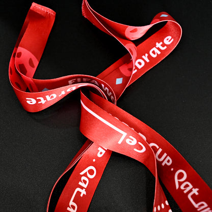 2022 FIFA World Cup Qatar Argentina Champions Medal - Red Commemorative Ribbon Close-Up, Featuring "FIFA WORLD CUP QATAR 2022" & "Celebrate" Text - Premium Souvenir Accessory for Football Fans