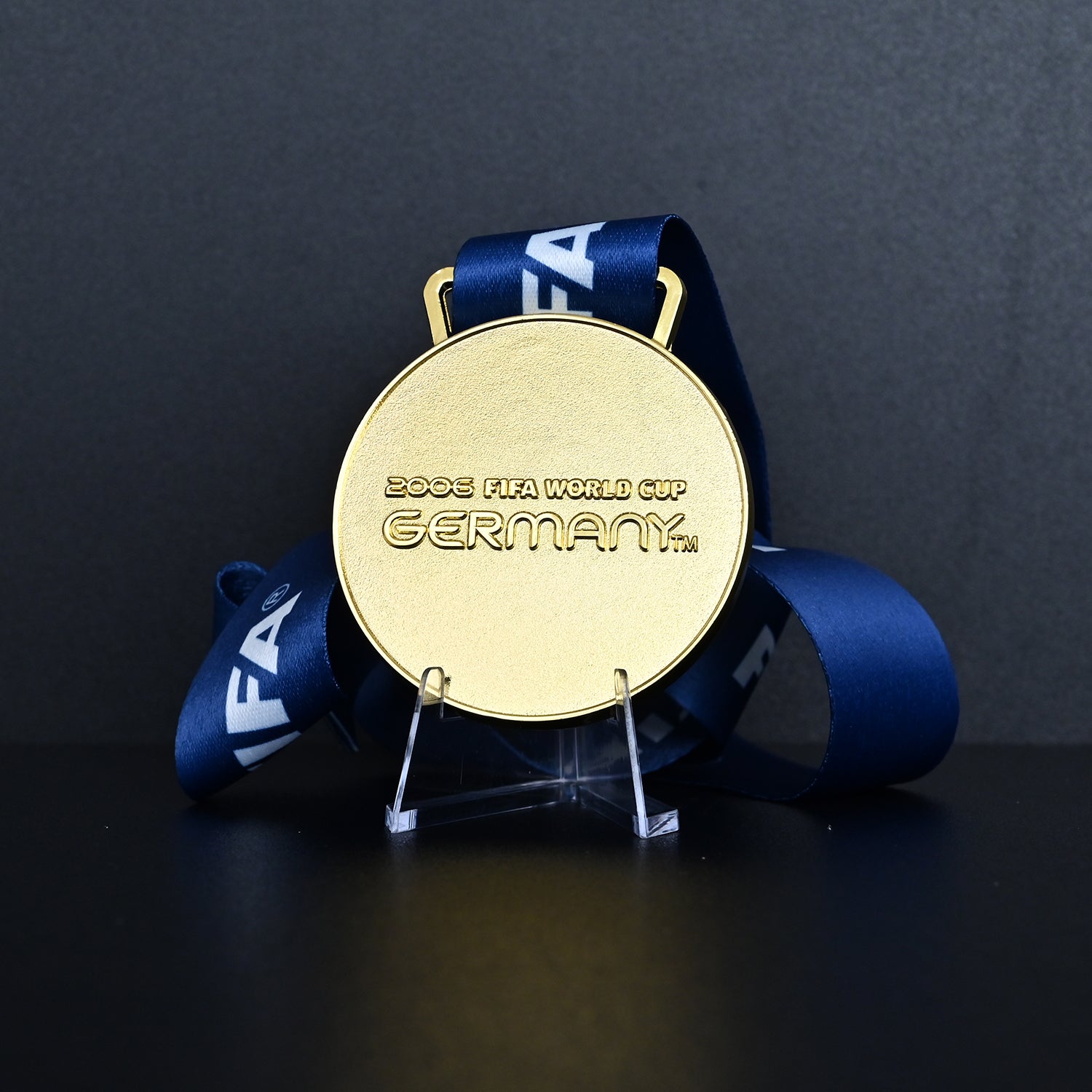 Germany 2006 FIFA World Cup Italy Champions Medal - Front View with Blue FIFA Ribbon, Featuring "2006 FIFA WORLD CUP GERMANY" Engraving, Premium Alloy Football Collectible
