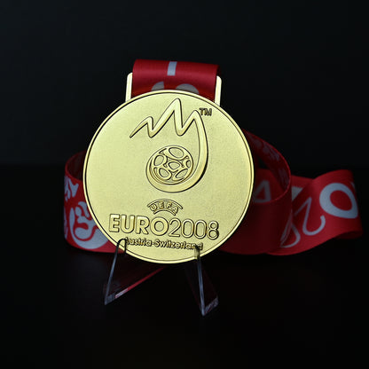 UEFA Euro 2008 championship medal, front flame & football emblem design, red tournament ribbon, Austria-Switzerland, Spain champion collectible, football memorabilia