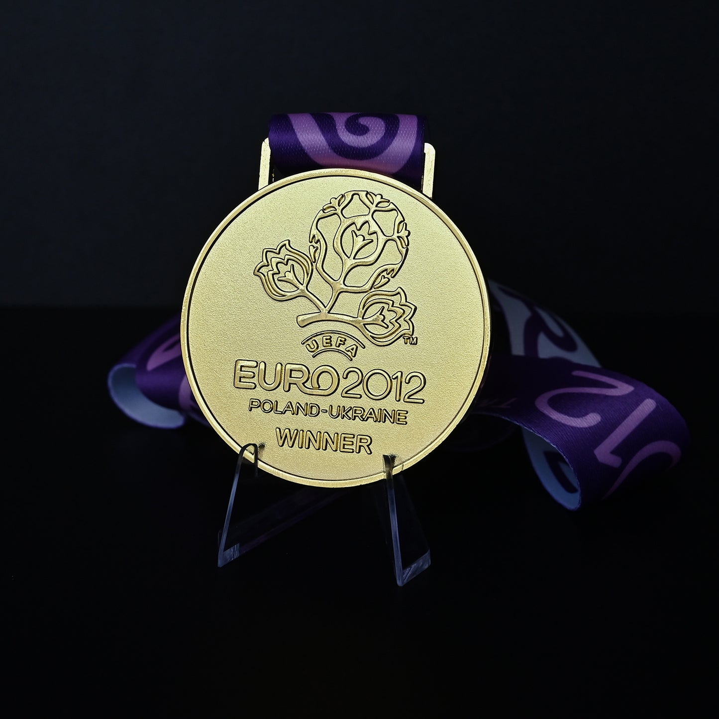 UEFA Euro 2012 championship medal, front floral winner design, purple tournament ribbon, Poland-Ukraine, Spain champion collectible, football memorabilia