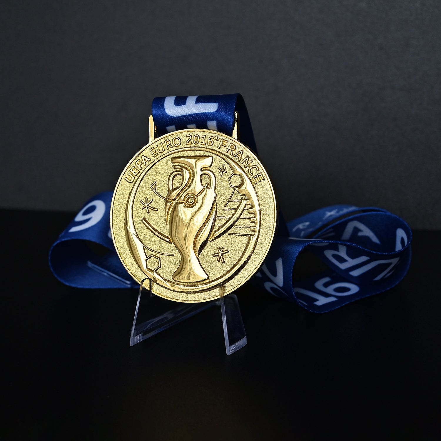 UEFA Euro 2016 championship medal, front trophy design, blue tournament ribbon, France 2016, Portugal champion collectible, football memorabilia