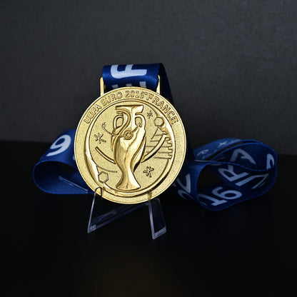 UEFA Euro 2016 championship medal, front trophy design, blue tournament ribbon, France 2016, Portugal champion collectible, football memorabilia